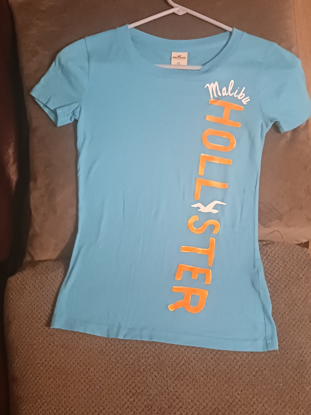 Hollister Light Blue Tee with Vertical Yellow Logo